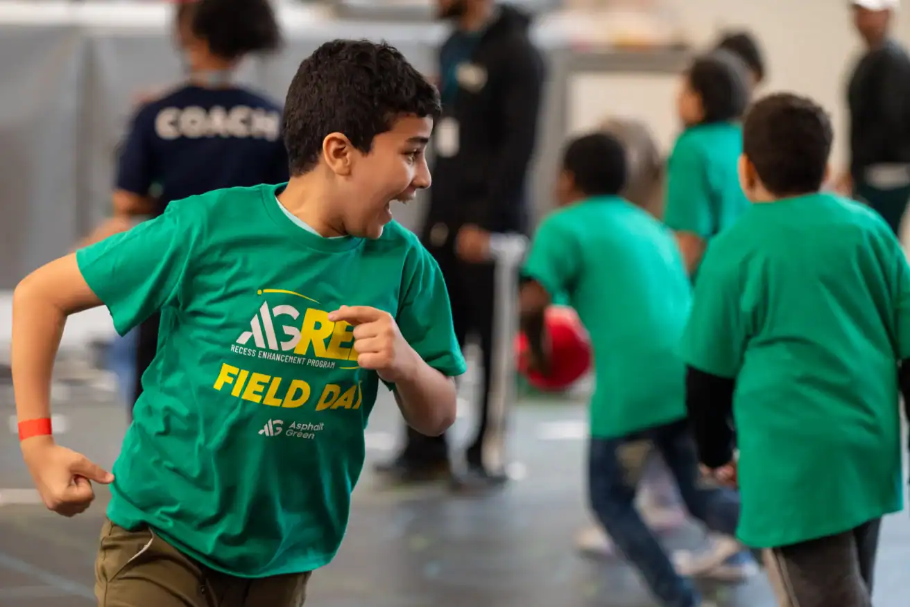 An Asphalt Green Recess Enhancement Program participates in an organized game.