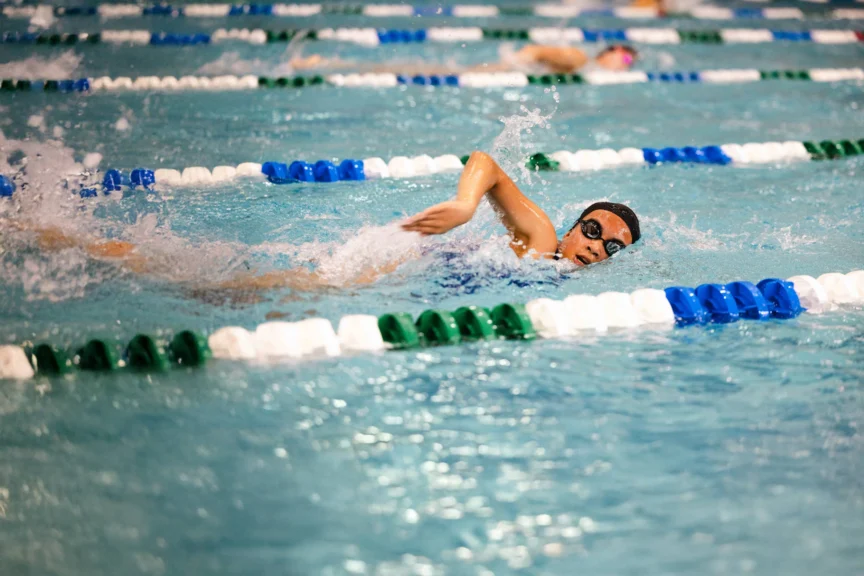 An AGUA youth swimmer competes in the pool during the 2025 season.