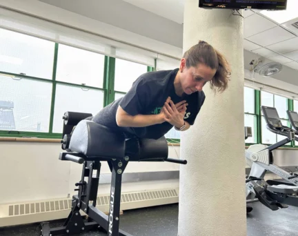 Asphalt Green Director of Fitness Nicole Lee performs a rep on the GHD Machine