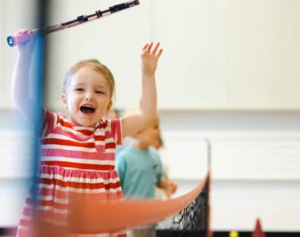 A young girl discovers passion for tennis in Asphalt Green's Tiny Aces Youth Tennis Class