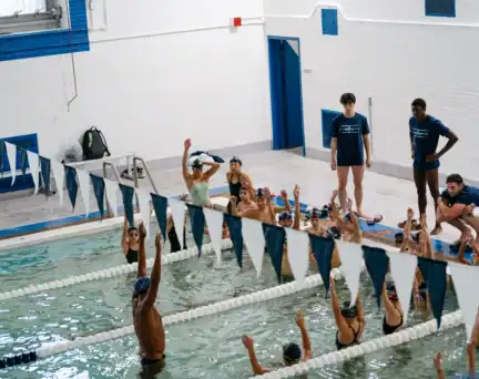 A group of swimmers take part in an AGUA swim clinic at River East Elementary School.