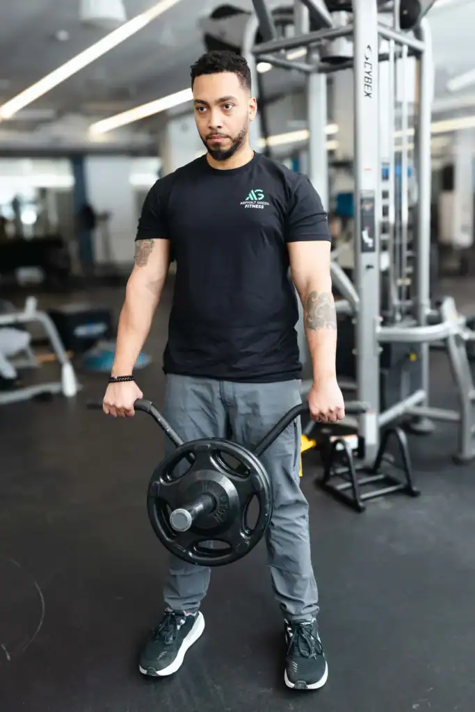 AG Fitness trainer performs the landmine bent over row exercise.
