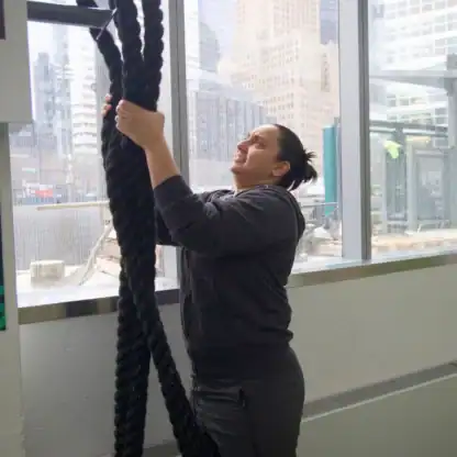 An Asphalt Green Fitness trainer sets up the battle ropes at Asphalt Green's Battery Park City fitness center. 